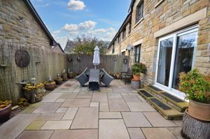 Paved rear garden- click for photo gallery